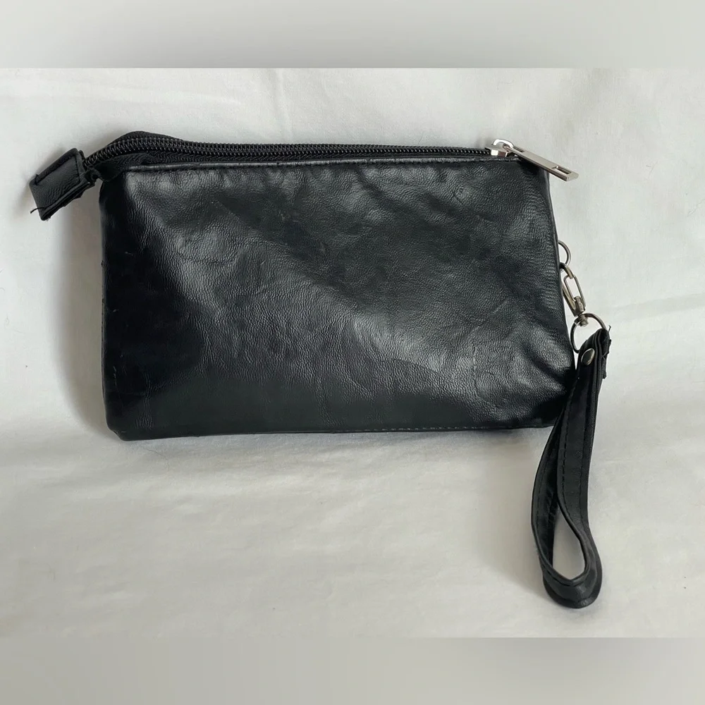 Fun little black faux, leather clutch wristlet three pocket with a zipper